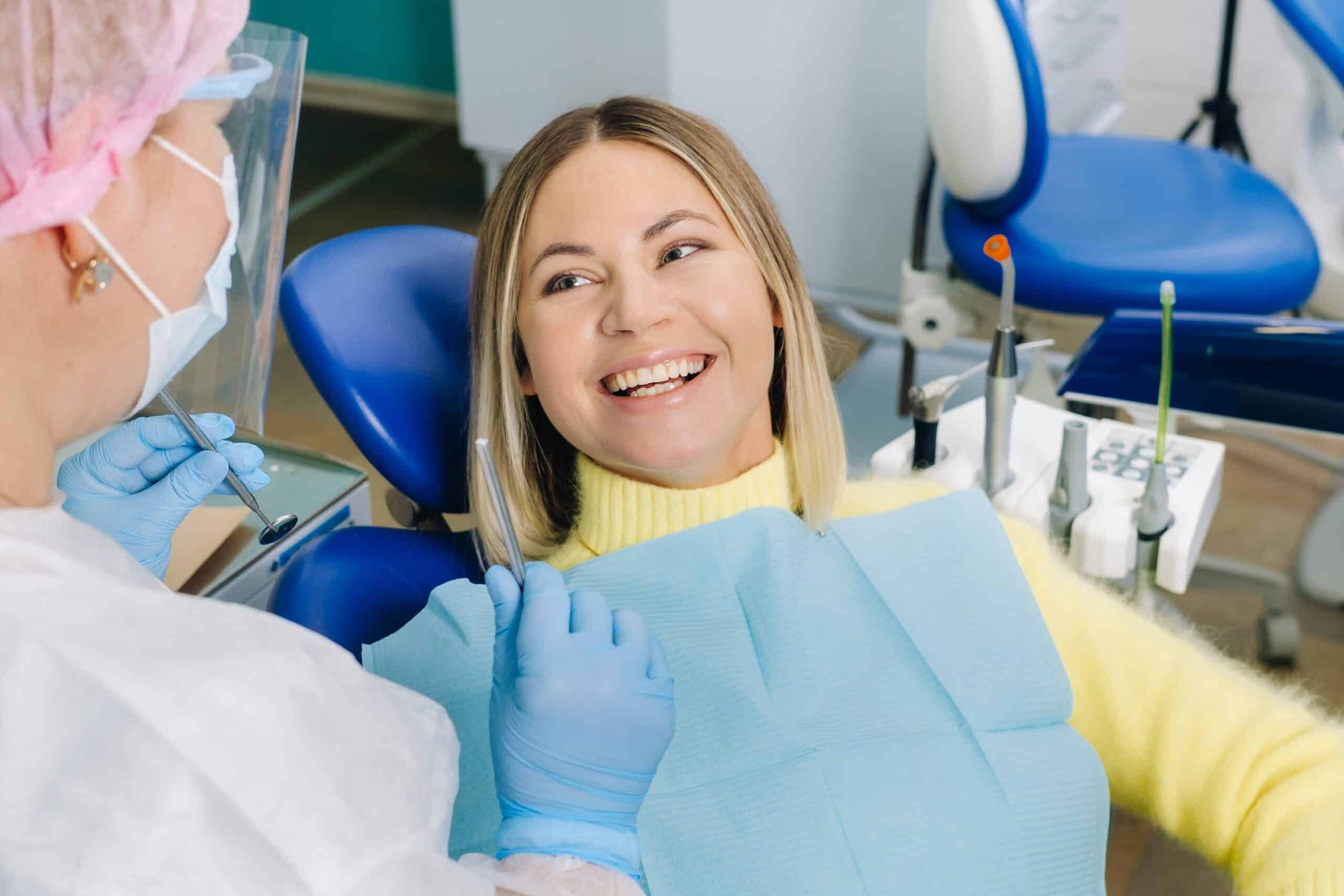 The,Girl,Smiles,At,The,Dentist,And,Looks,At,Her.