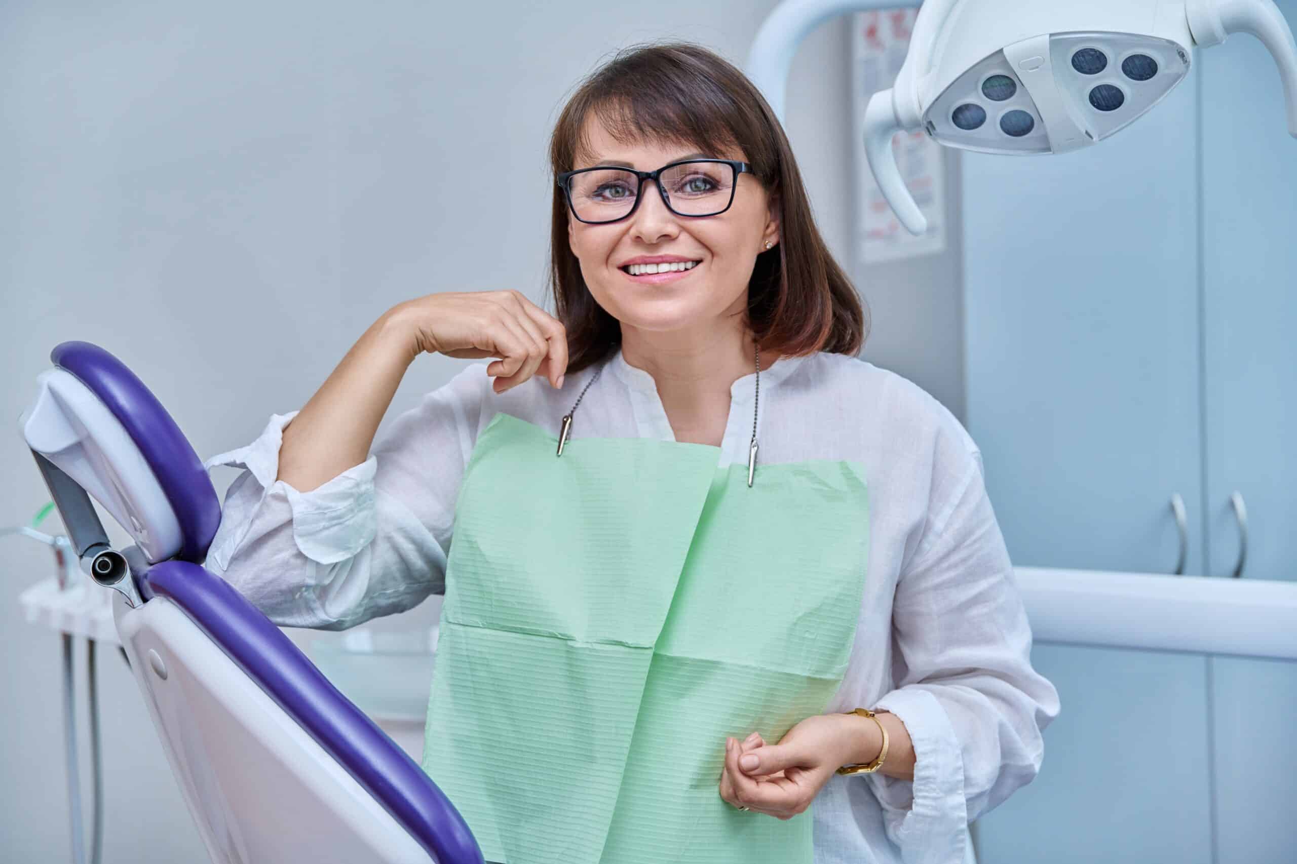 Happy,Middle,Aged,Woman,Patient,Looking,At,Camera,Sitting,In