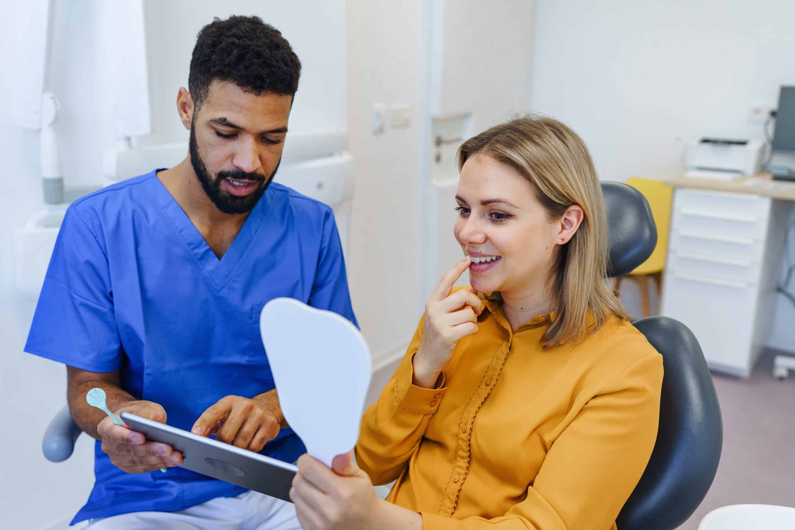 Young,Woman,Having,Consultation,With,Multiracial,Dentist.